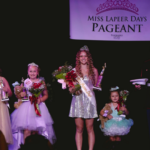 Former Miss Lapeer Days Pageant winners standing together and smiling
