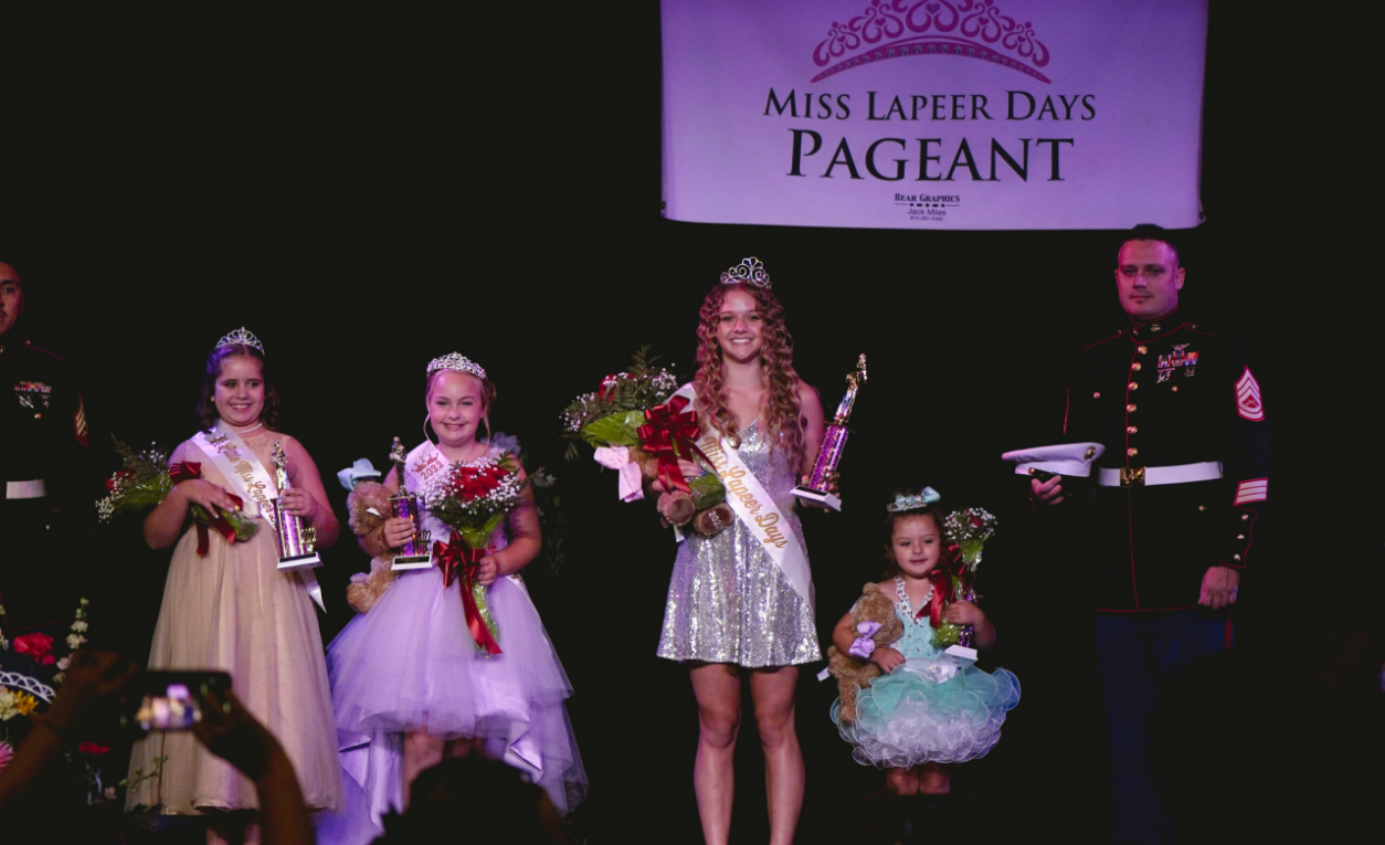 Former Miss Lapeer Days Pageant winners standing together and smiling