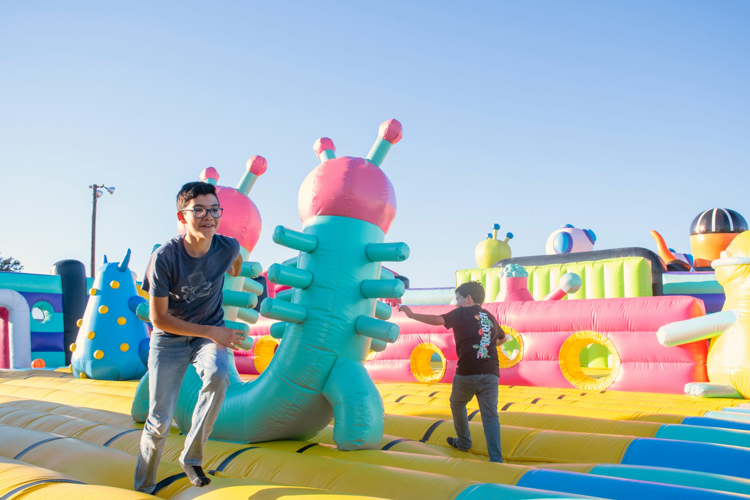 A child playing on a blow-up play structure