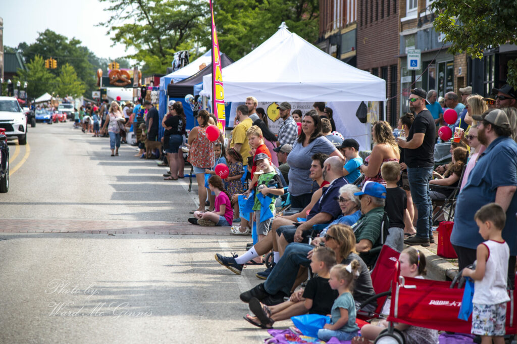 A group of people waiting for the parade to start